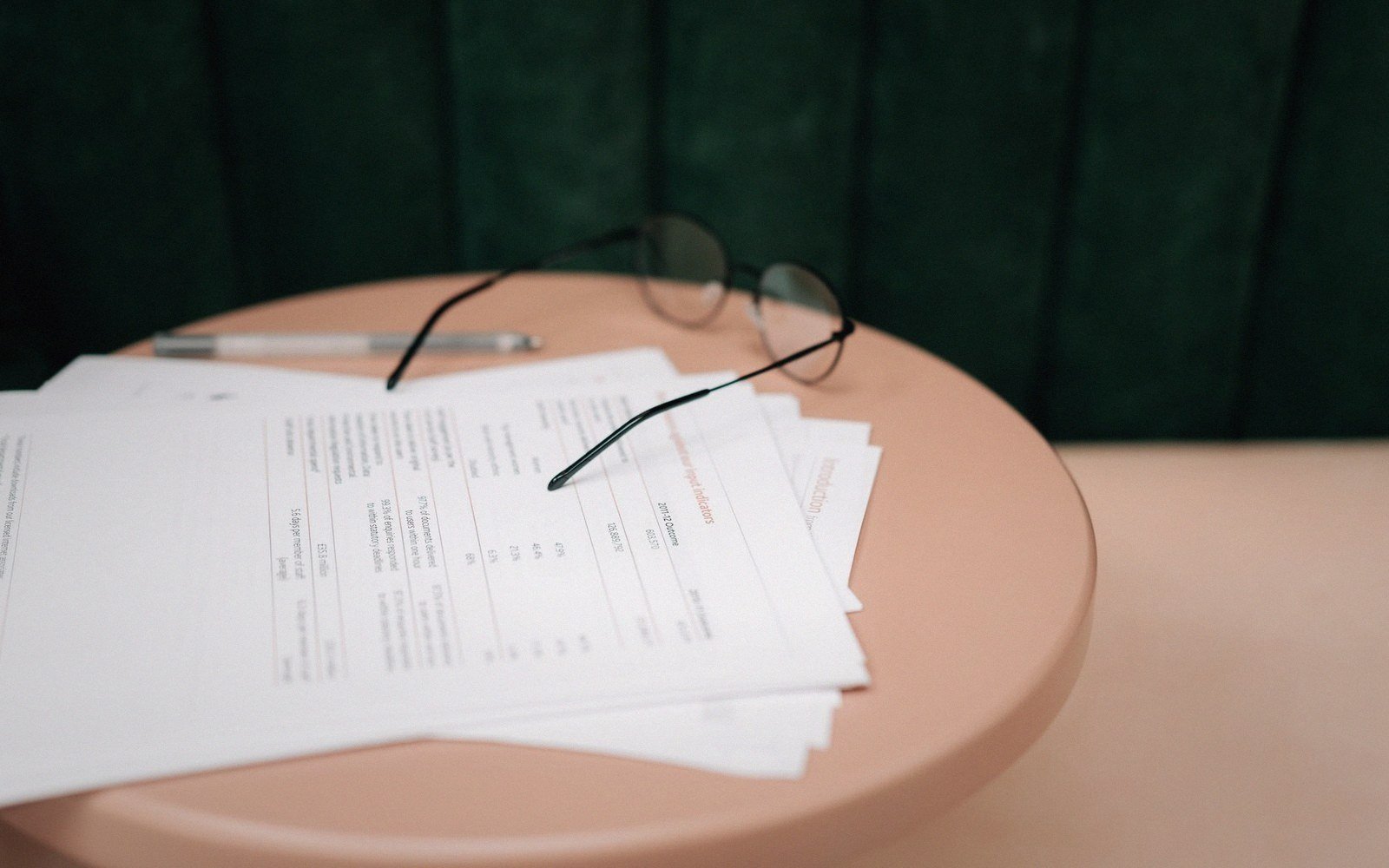 A fanfold printout listing open across a desk